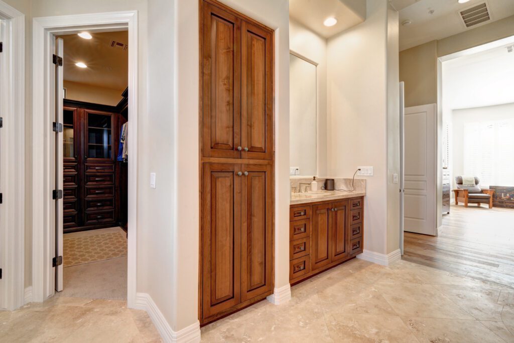 A bathroom with a large cabinet and sink.
