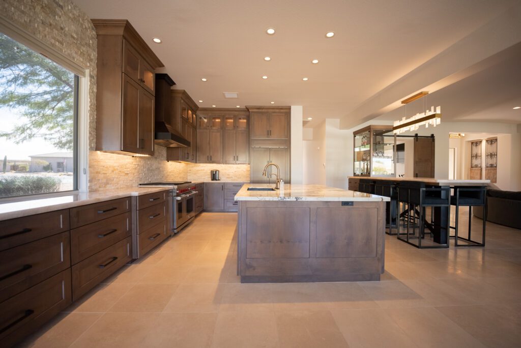 A kitchen with an island and wooden cabinets